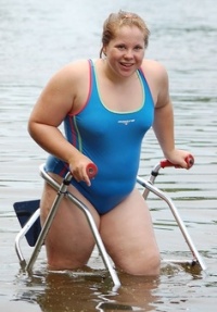 [ Marat5hon swimmer and water skier Jenna exits the water after completing a ski! ]