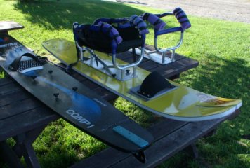   [ Some of the adaptive equipment, sit-skis and cages, used in our program. ]